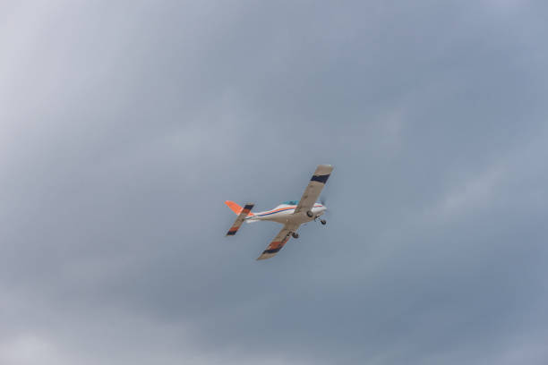 istock Light turboprop aircraft flies in the sky 1196847053