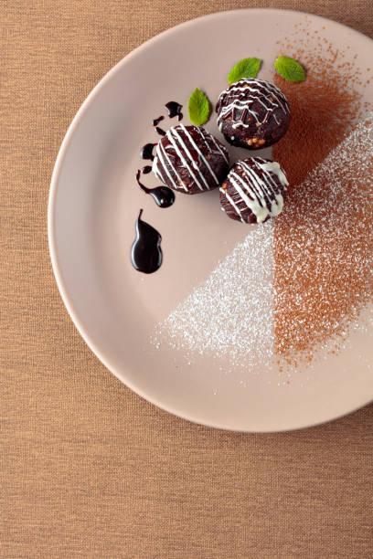 istock Chocolate balls with mint on a beige plate. 1196847831