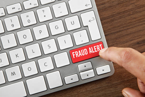 "Fraud alert" button hand clicking on an “Fraud alert” key white collar crime photos stock pictures, royalty-free photos & images