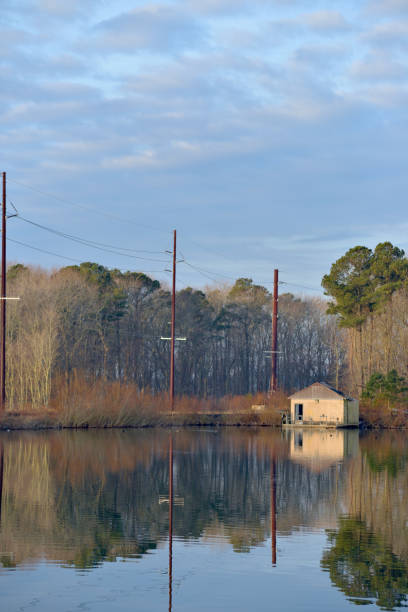 istock Polluted Waste Water Pond and Pump House - I 1196856111