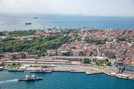 Istanbul, Turkey - June 9, 2013; Istanbul aerial photo, 1500 feet shot from helicopter. View of Eminonu ferry port, Gulhane park, Hagia Sophia, Blue Mosque and Marmara Sea from helicopter.