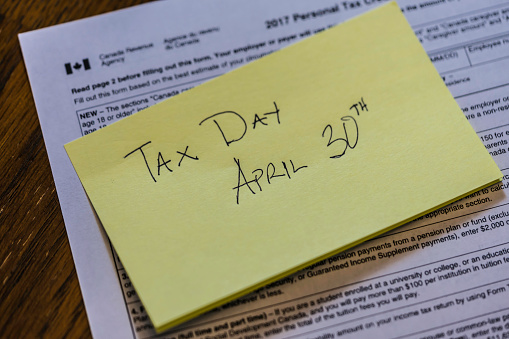 Sticky Note on Canadian Tax Form to show Canada Tax Day - April 30