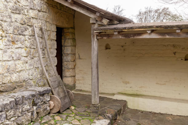 istock Ancient handcart on a house wall 1196861763