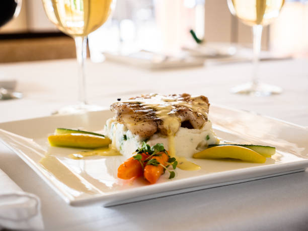 istock Fancy dish of a fish filet and white wine sauce 1196866795