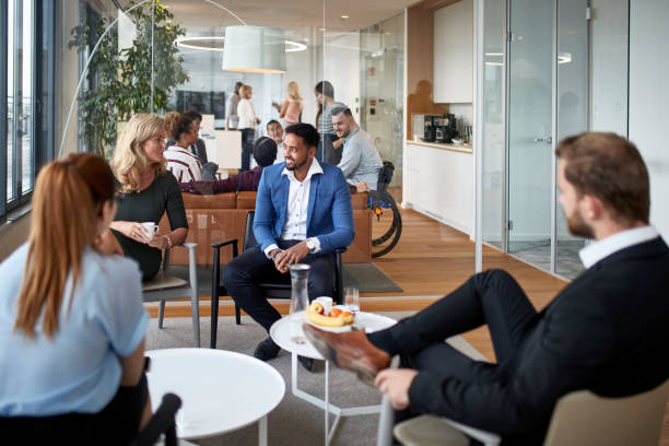 istock Businesspeople Conversing at Corporate Social Gathering 1196879660