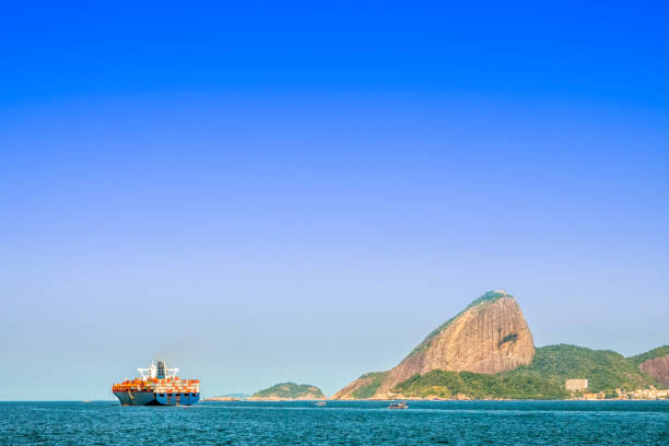 Sugarloaf in the background\nShip going in direction of the Atlantic Ocean