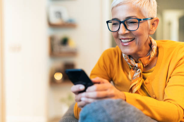 istock Modern mature woman texting 1196888469