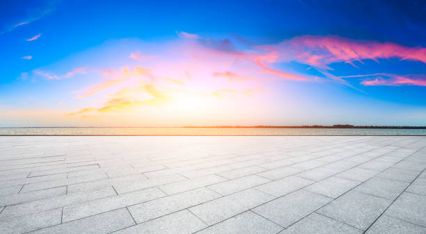 istock Empty floor and lake with dreamy clouds at sunset. 1196890676