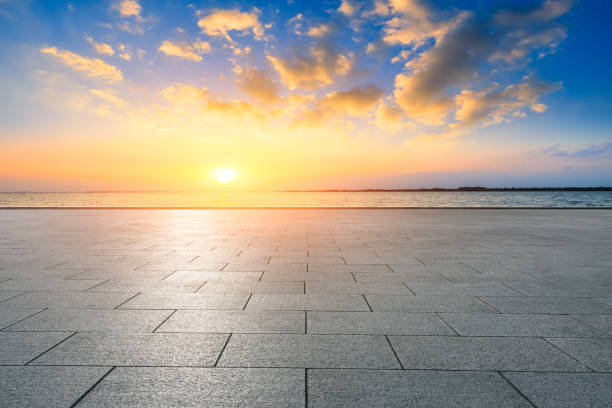 istock Empty floor and lake with dreamy clouds at sunset. 1196890836
