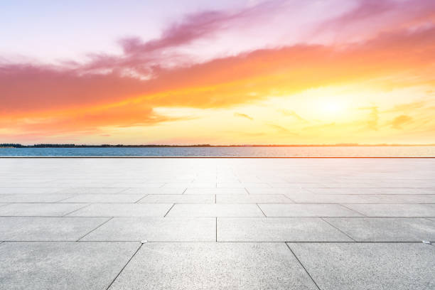 istock Empty floor and lake with dreamy clouds at sunset. 1196891379