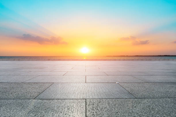 istock Empty floor and lake with dreamy clouds at sunset. 1196891417