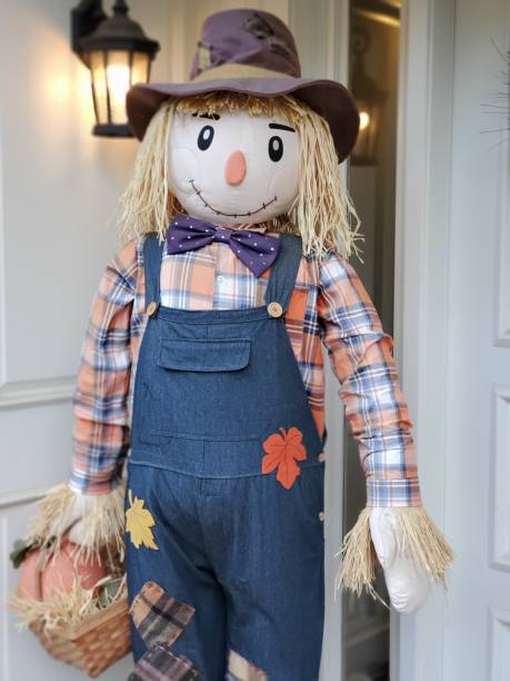 istock Straw man standing on a porch. 1196891508