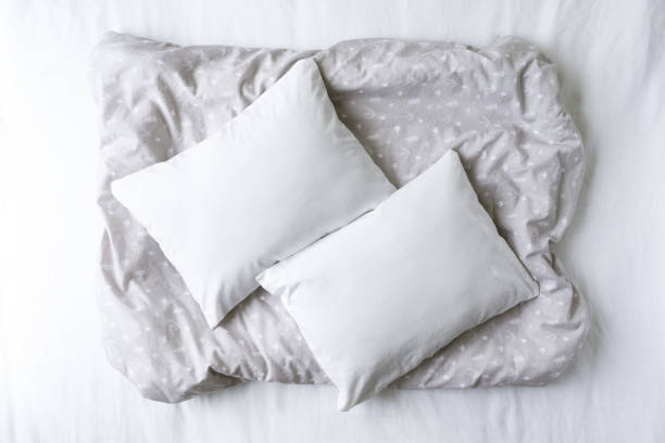 istock Two Blank White Pillows On a Patterned Grey Background Mockup - Styled Stock Photography - Twin Cushions Flat Lay Mockup - Pillowcase Mockup 1196892206