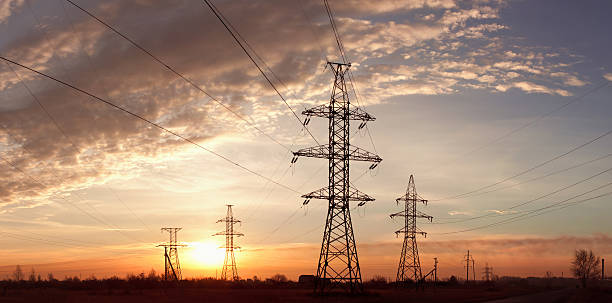 istock Electricity pylons and lines at dusk. 119689280
