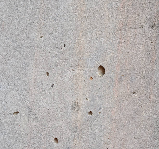 istock texture of gray cracked cement, element for the designer, full frame. Grey stone background. 1196895630