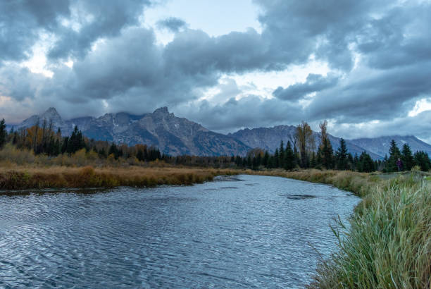 istock Cloudy skies and mountains in fall at sunrise 1196897970