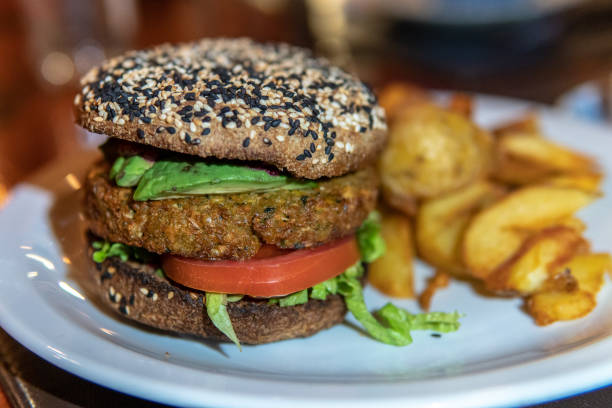 istock Veggie burger with tomatoes and fried 1196902114