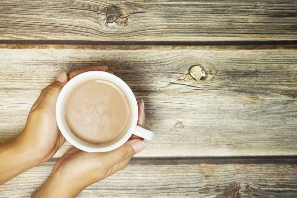 istock Hands holding a cup of coffee 1196906955