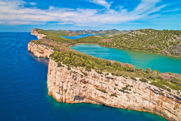 Telascica nature park and green Mir lake on Dugi Otok island aerial view Telascica nature park cliffs and green Mir lake on Dugi Otok island aerial view, Kornati archipelago national park of Croatia dugi otok island stock pictures, royalty-free photos & images