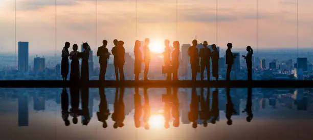 Photo of Group of businessperson in front of the city.