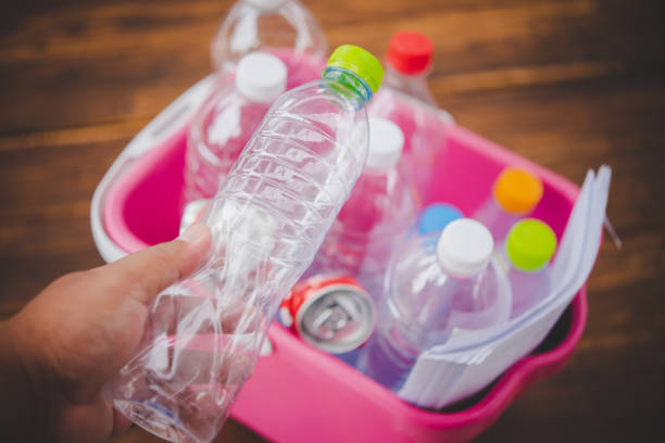 istock Hands holding bottles for recycling, green concept 1196912946