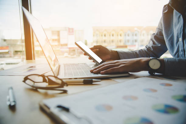 istock Business woman working on laptop computer in office 1196914780