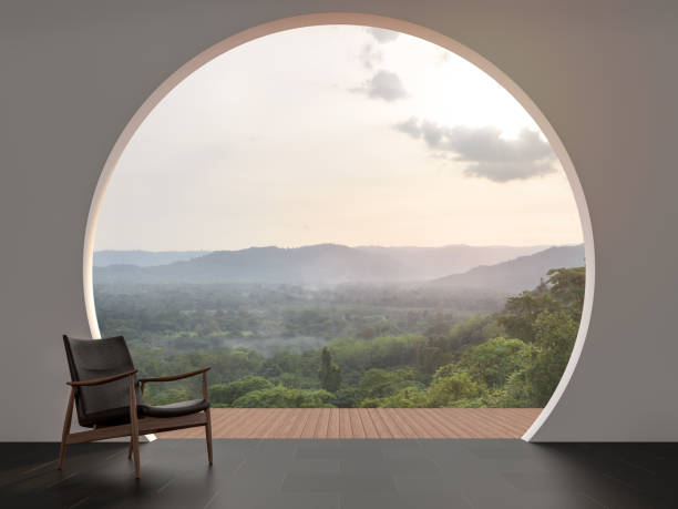 A wall with arch shape gap looking out over the mountains 3d render A wall with arch shape gap looking out over the mountains 3d render,The room has black tile floor.Furnished with wood and leather chair.Looking out to the balcony and nature view. hotel window view stock pictures, royalty-free photos & images