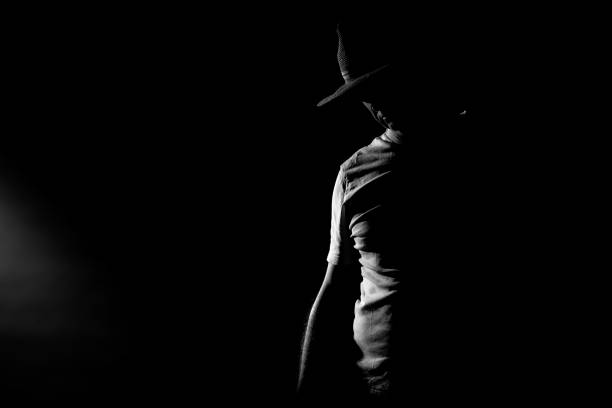 Shapes of a man with hat isolated on black background