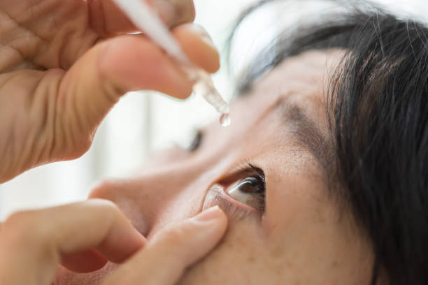 istock Woman use eye drop, artificial tears to the eye 1196924086