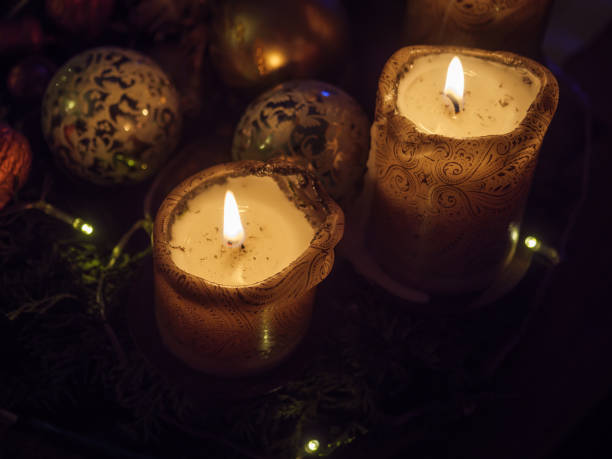 istock christmas time with burning candles 1196934565