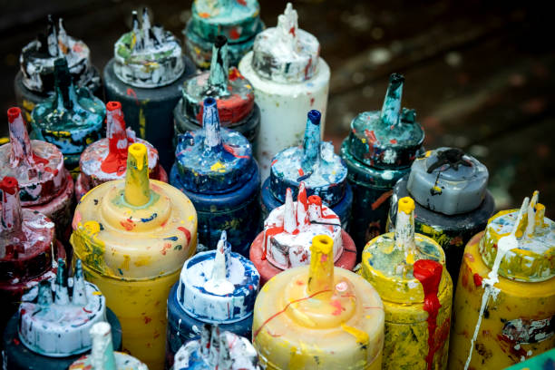 istock stack of grungy oil color paint bottle on table 1196939593