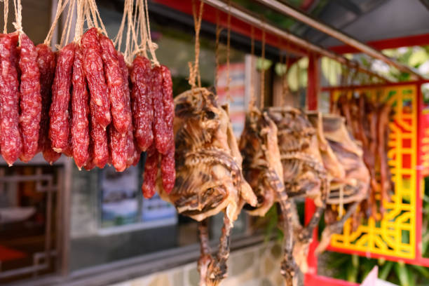 istock air-dried sausages and ducks  hanging on shelf 1196941606