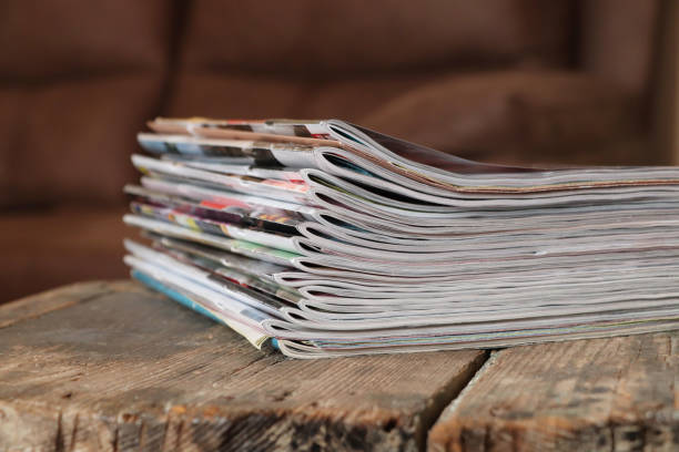 istock Old magazines on wooden table 1196944830