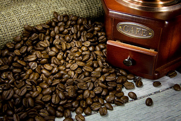 istock coffee beans and wood grinder on sacking 119694573