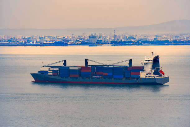 istock Cargo ships transporting containers in the evening light. Concept of transport and commerce by sea. Lisbon, Portugal. Europe 1196945878