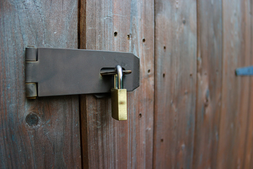 Close up of the lock on a closed shed with copy space available