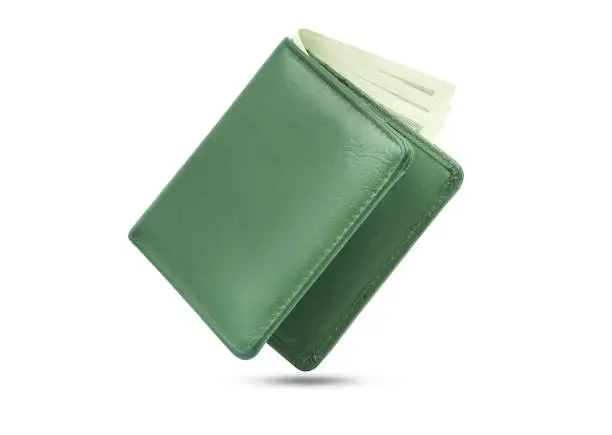 Photo of Close-up of Wallet green color genuine leather texture with banknotes and credit card inside isolated on white background,  Male purse.