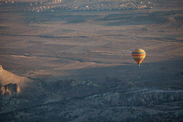 istock Hot Air Balloon Flying Over Cappadocia 1196955994