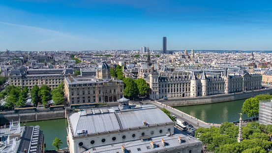 Aerial View of Paris with the Seine River in the foreground and residential and commercial districts in the background as seen from the Eiffel Tower