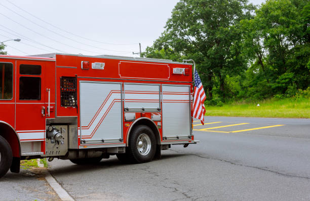istock Fire trucks and firefighters brigade in the road 1196959881