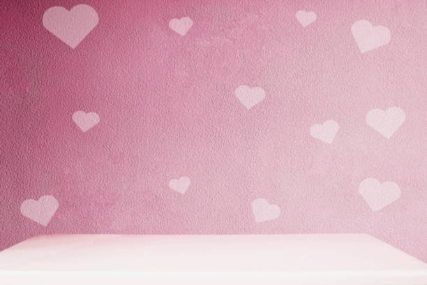 istock red heart of love wall and empty table top 1196962910