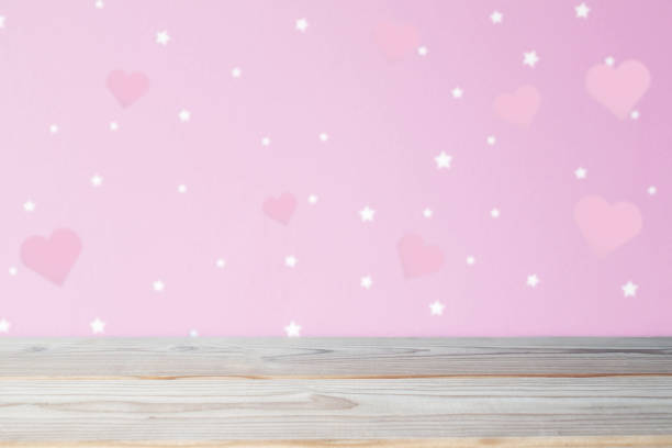 istock red heart of love wall and empty table top 1196962922