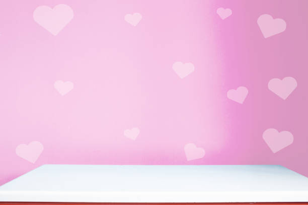 istock red heart of love wall and empty table top 1196963074