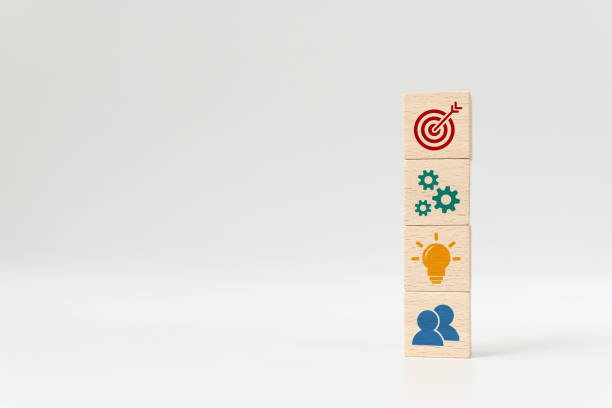 istock Concept of business strategy and action plan. Wood cube block stacking with icon on white background 1196964123