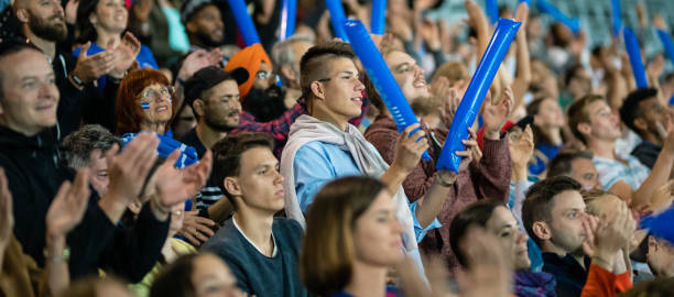 istock People In A Stadium Cheering 1196965814