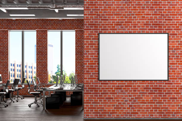 Blank horizontal poster mock up on the red brick wall in office interior