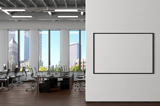 Blank horizontal poster mock up on the white wall in office interior. 3d render.