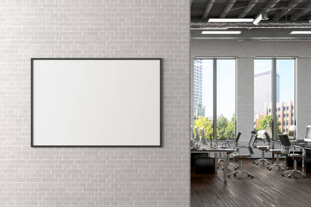 istock Blank horizontal poster mock up on the white brick wall in office interior 1196966499