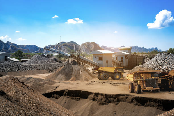 Mining Yellow dump truck loading minerals copper, silver, gold, and other  at mining quarry. copper mine photos stock pictures, royalty-free photos & images