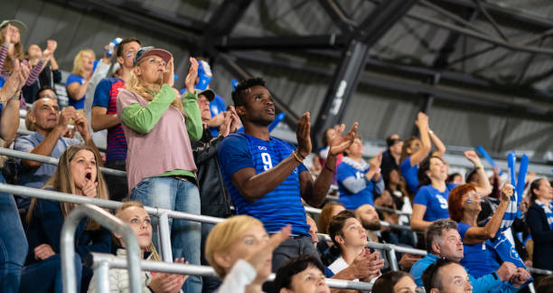 istock People In A Stadium Cheering 1196967555